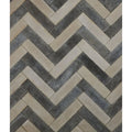Reform composite stone tumbled bianco features herringbone-patterned stone tiles in beige and dark gray tones