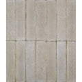 Beige rectangular reform composite stone tumbled bianco tiles arranged in a grid pattern showing textured surface