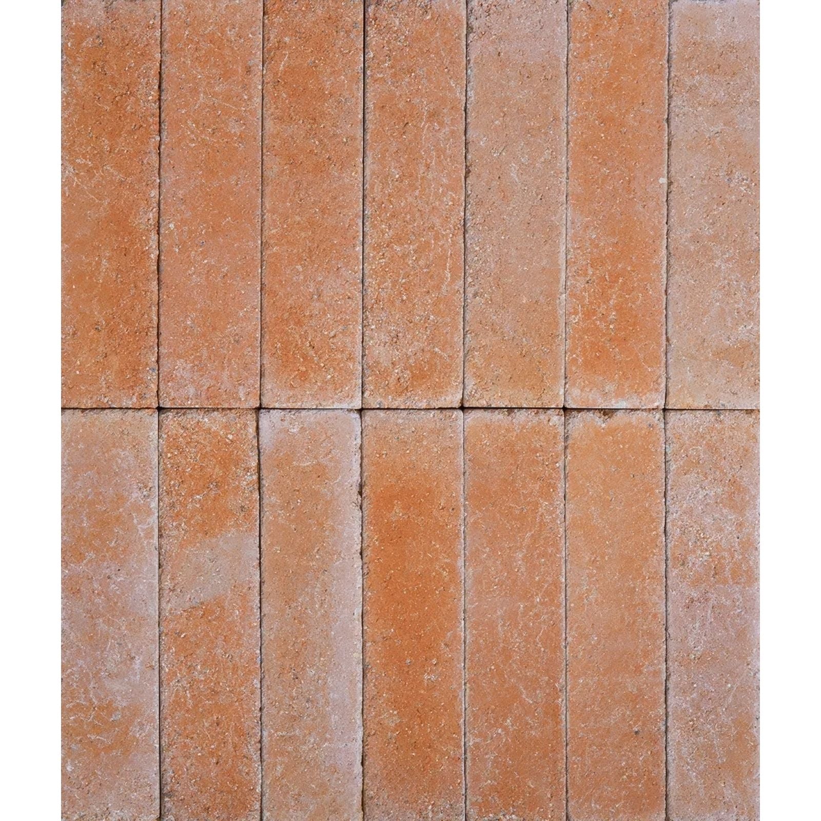 Terracotta colored reform composite stone tumbled cotto rectangular tiles with a textured rustic surface