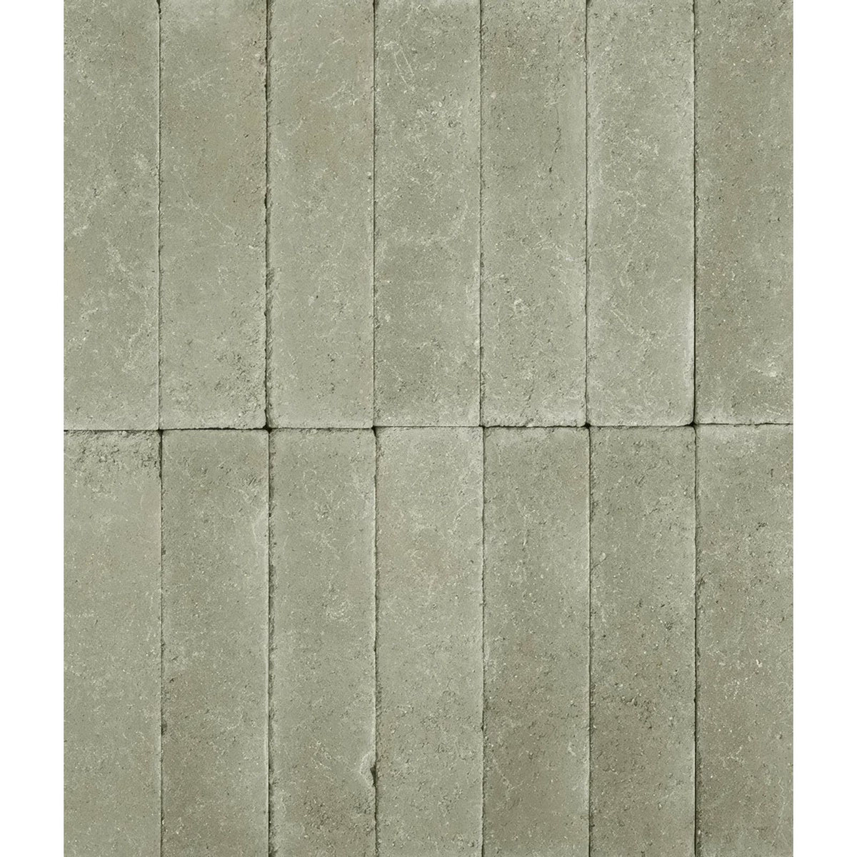 Gray stone tiles with textured natural finish arranged in vertical rows reform composite stone tumbled mint