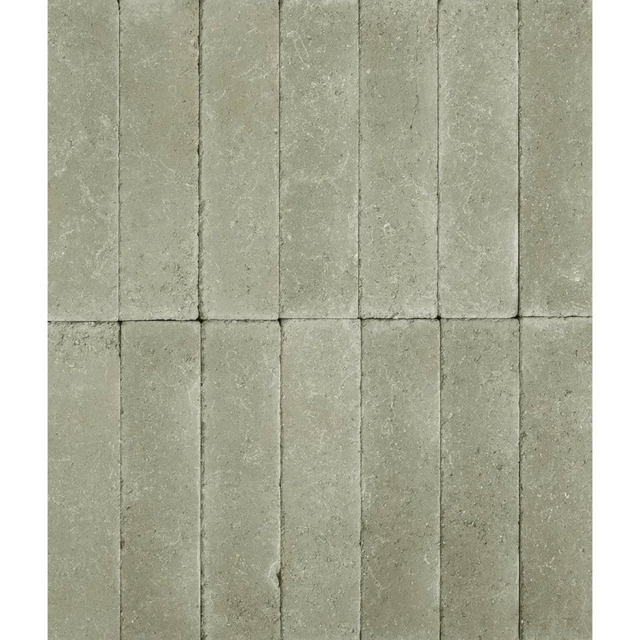 Gray stone tiles with textured natural finish arranged in vertical rows reform composite stone tumbled mint