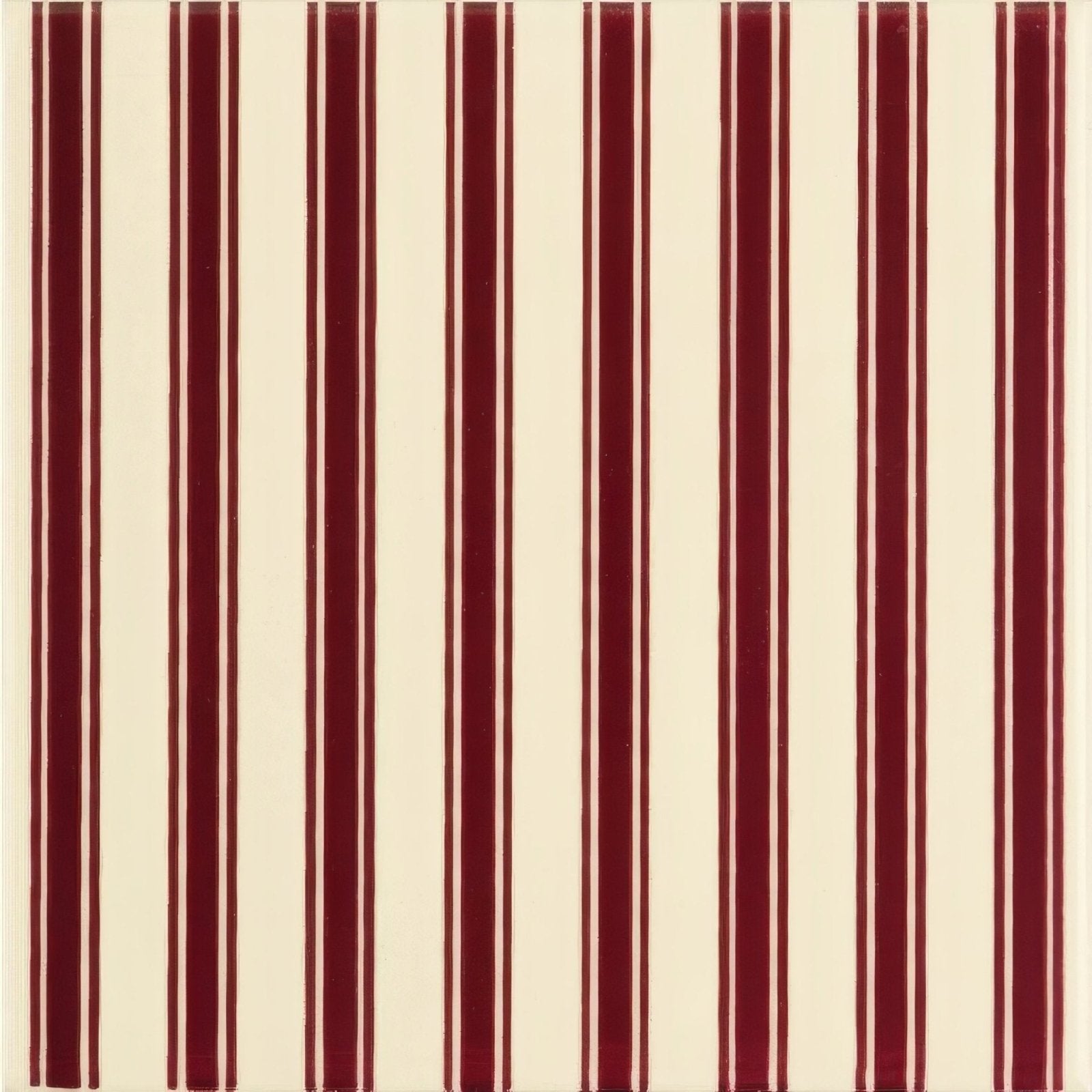 Cream-colored wallpaper with bold vertical burgundy stripes in the Regency Stripe Burgundy design on County White background