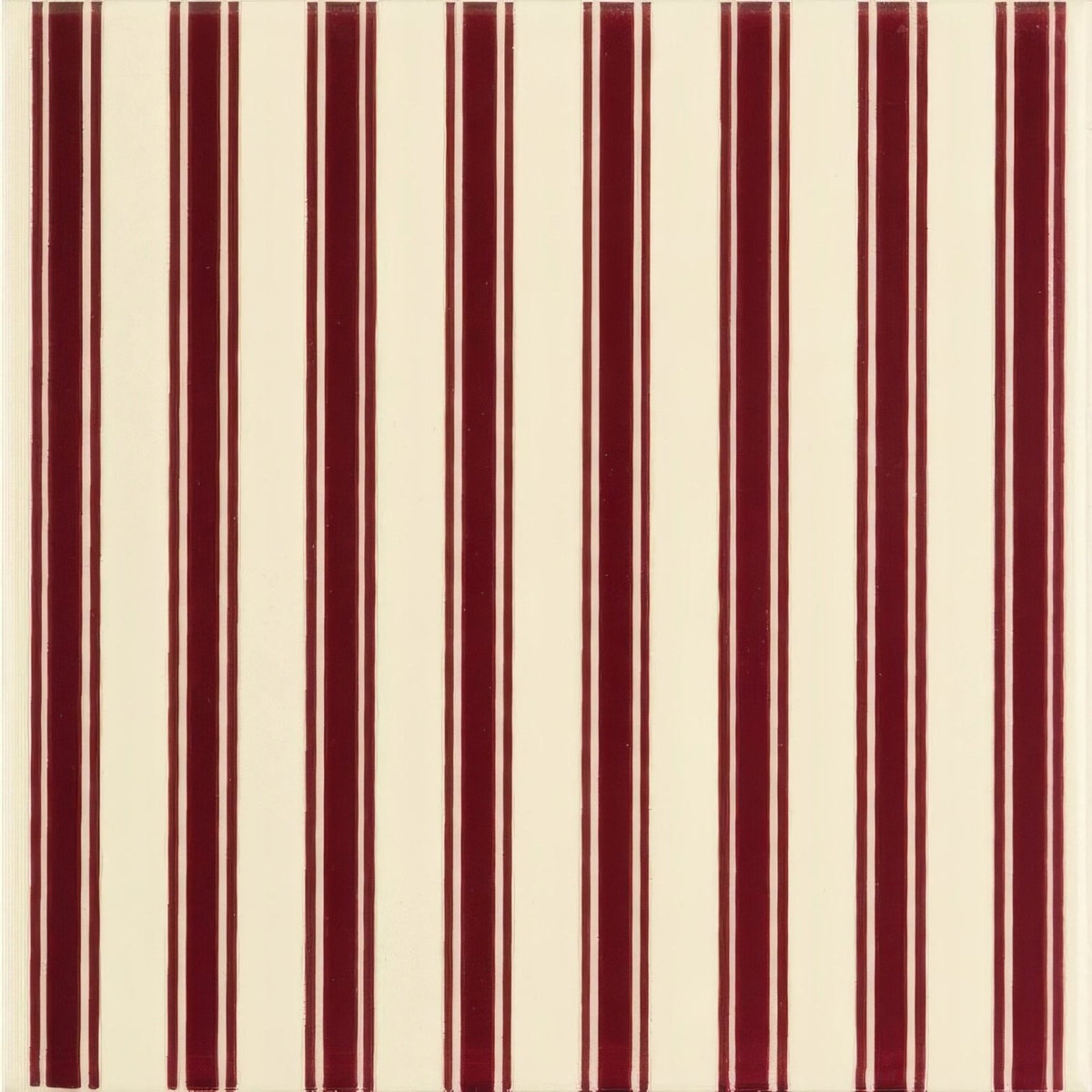 Cream-colored wallpaper with bold vertical burgundy stripes in the Regency Stripe Burgundy design on County White background