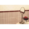 Brass-framed oval vanity mirror with slender stand in regency stripe burgundy on county white background