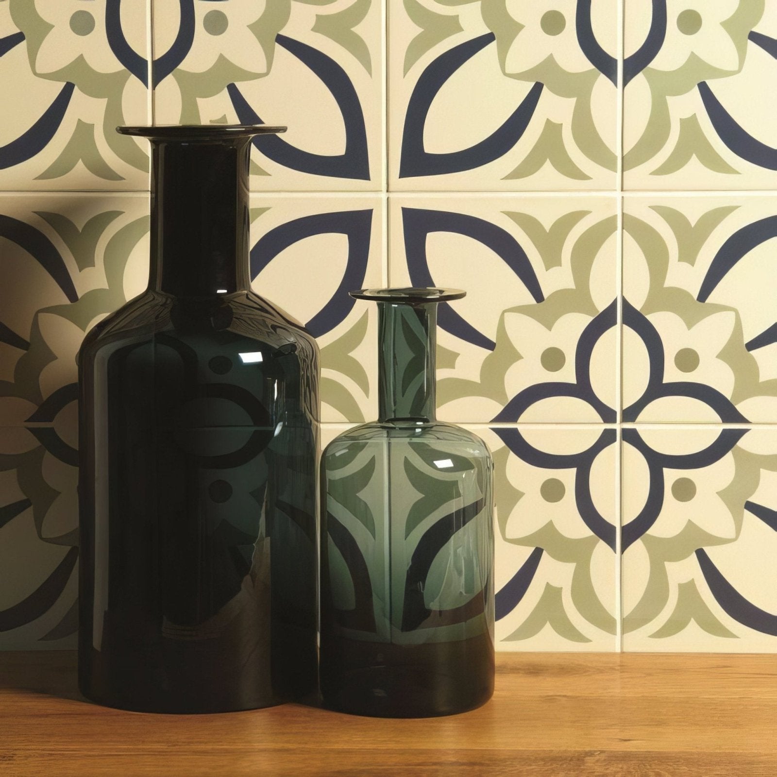 Two sleek glass Renaissance Dublin vases in khaki dark blue white featuring black and translucent teal leaf patterns