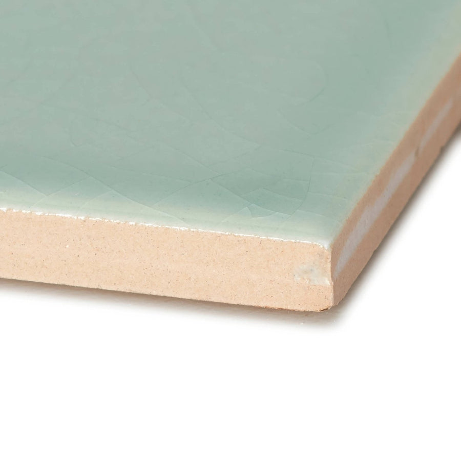 A square retro metro lime house 10 x 30 glazed ceramic tile with smooth matte mint green glaze and unglazed beige clay edge