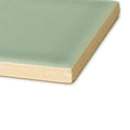 A retro metro lime house 7.5 x 15 glazed ceramic tile with smooth matte sage green finish and unglazed beige edge