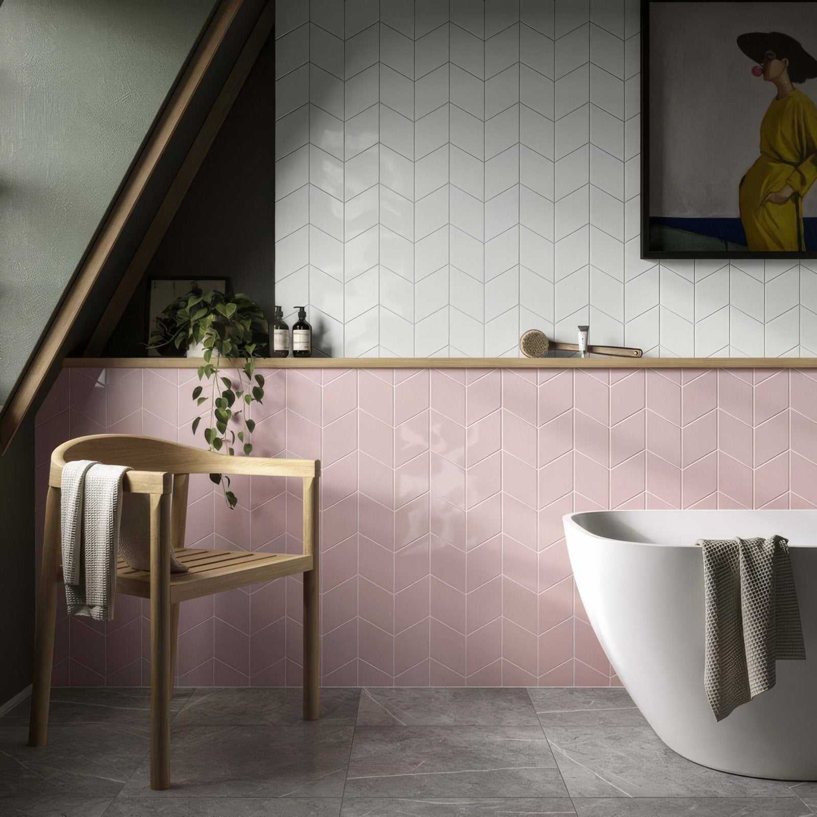 The bathroom features a sleek modern freestanding white ceramic bathtub with elegant curved design and rhomboid pink ceramic wall tiles