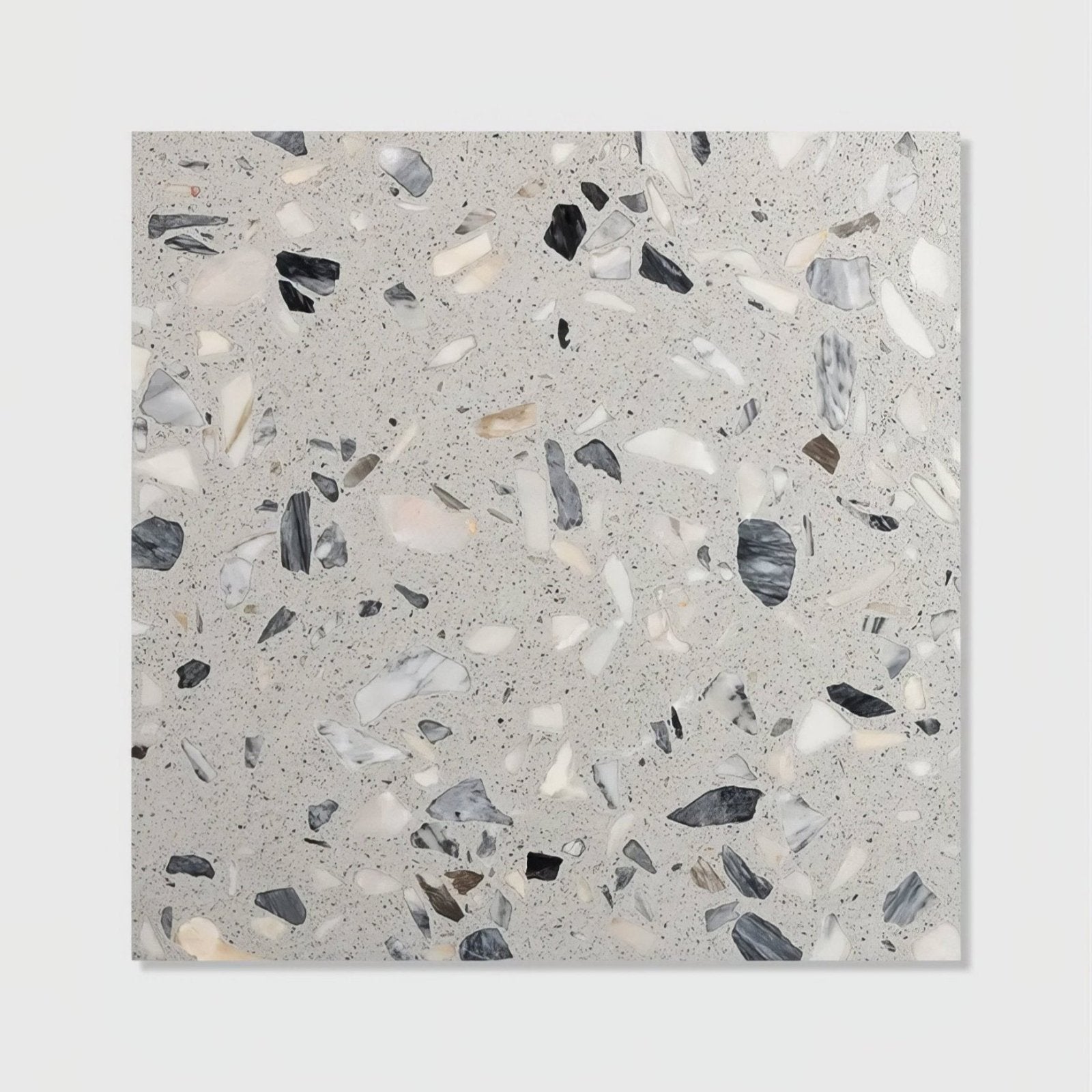 Gray terrazzo castello honed tile featuring a speckled pattern of black white and beige stone fragments