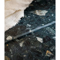 A sleek dark green rialto terrazzo foscari honed tile with white and black stone speckles