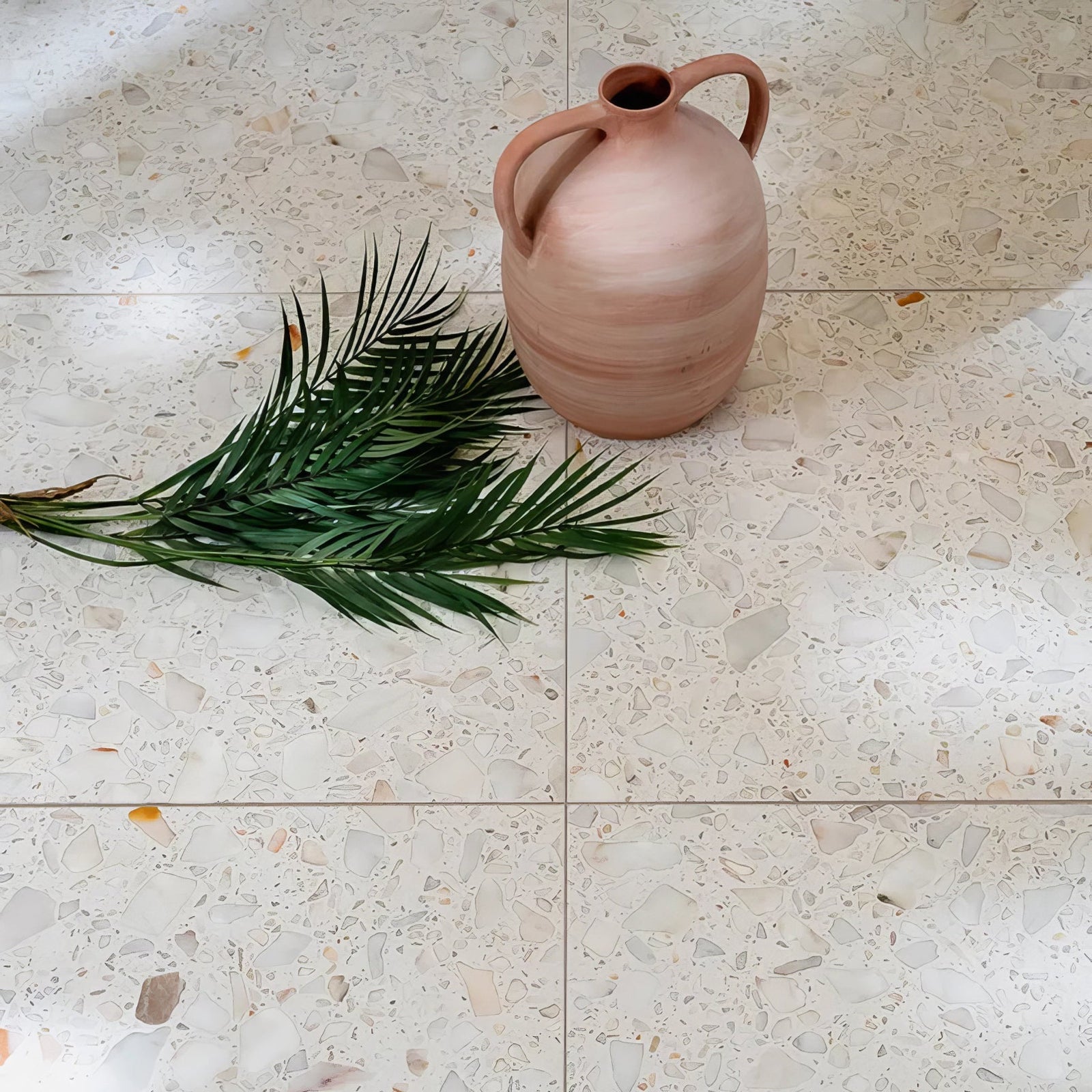 Rialto Terrazzo Veneta Honed soft pink terrazzo tiles with a terracotta jug