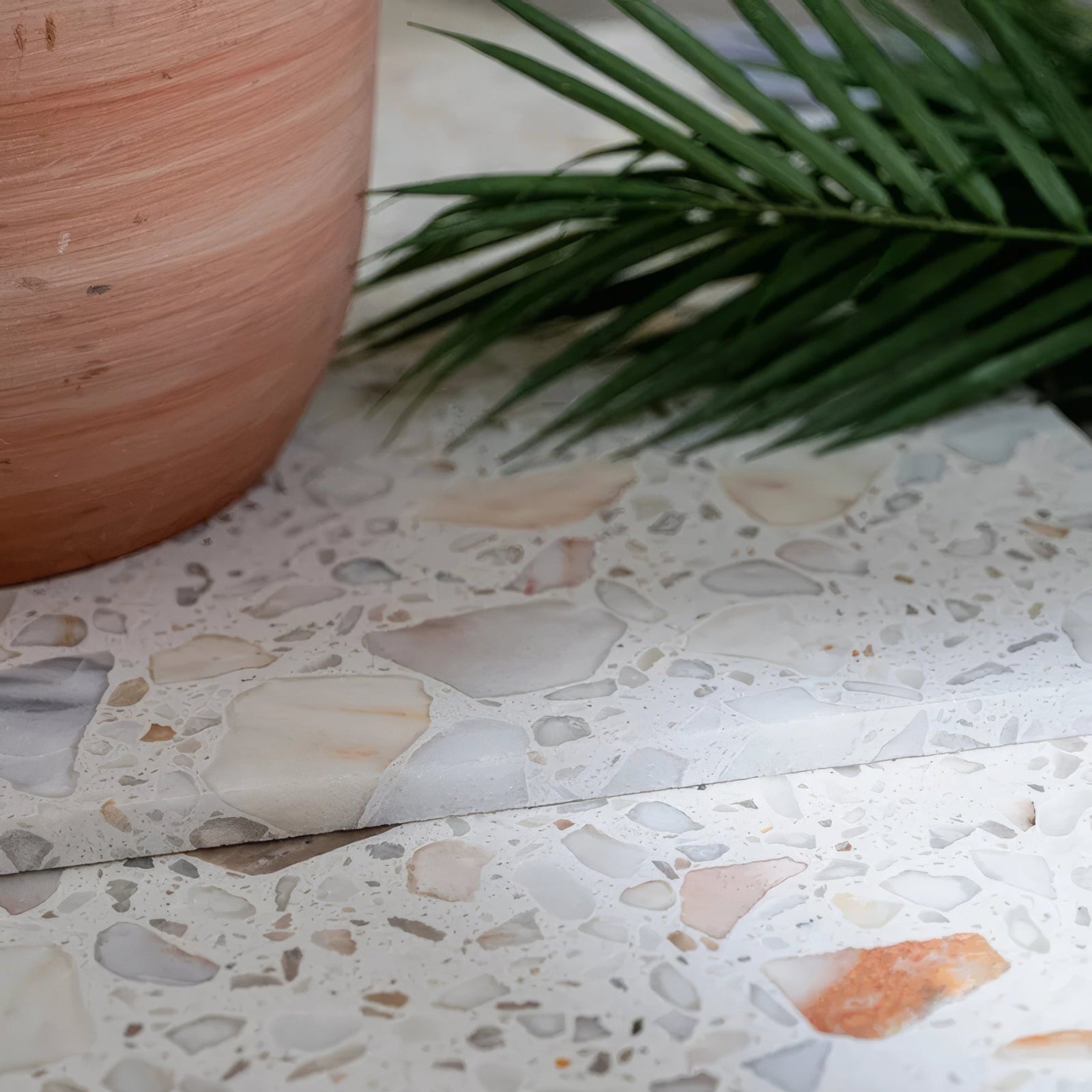 Rialto terrazzo veneta honed countertop with speckled white gray and warm peach stone fragments in light binder