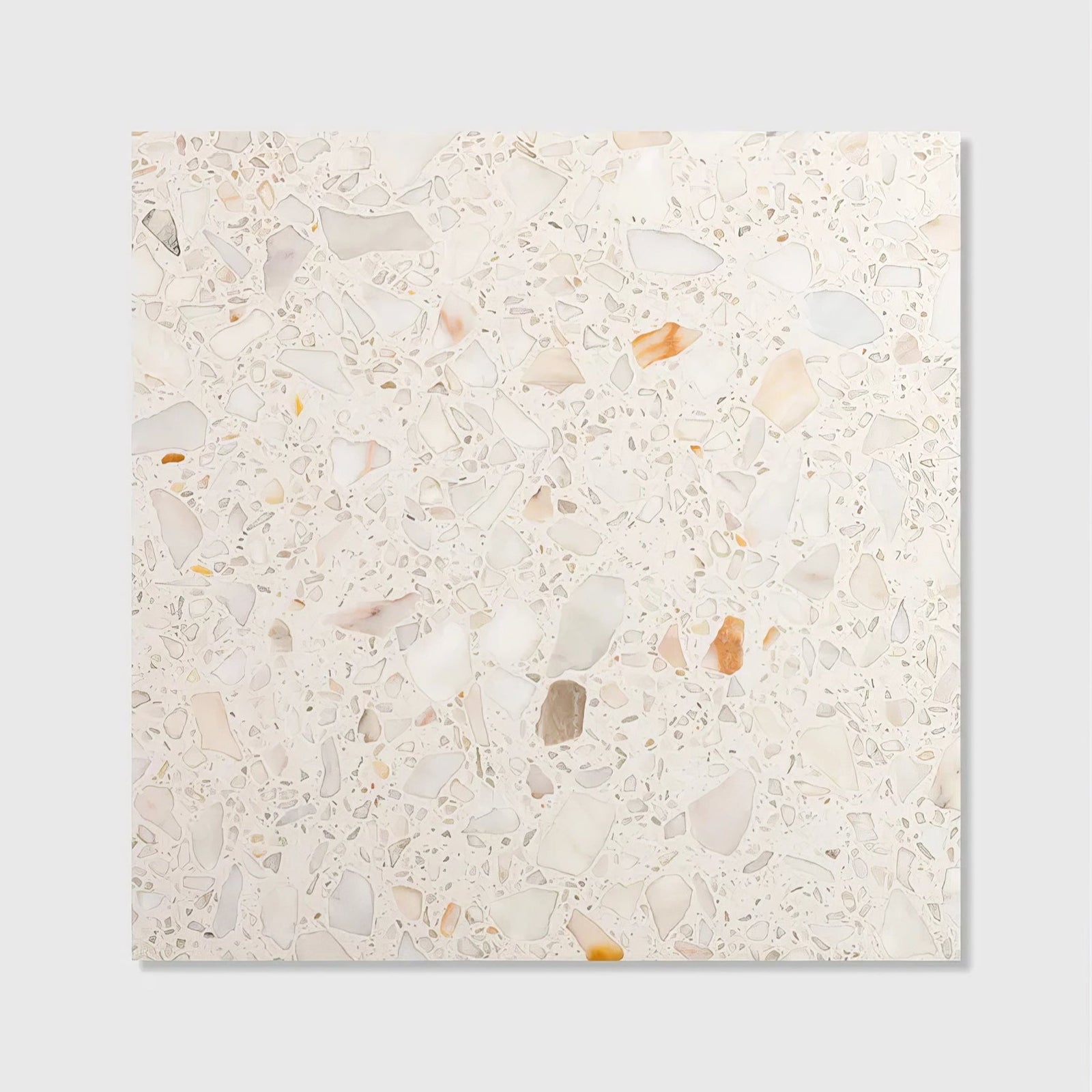 A square rialto terrazzo veneta honed tile with creamy white base and scattered beige pink and muted orange marble fragments