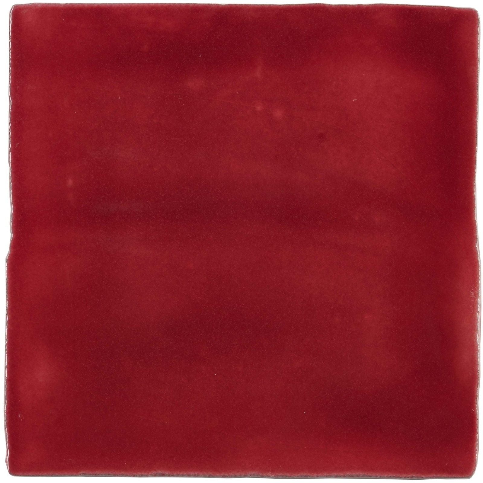 A square rioja field tile made of matte-finished ceramic in deep burgundy with subtle surface variations