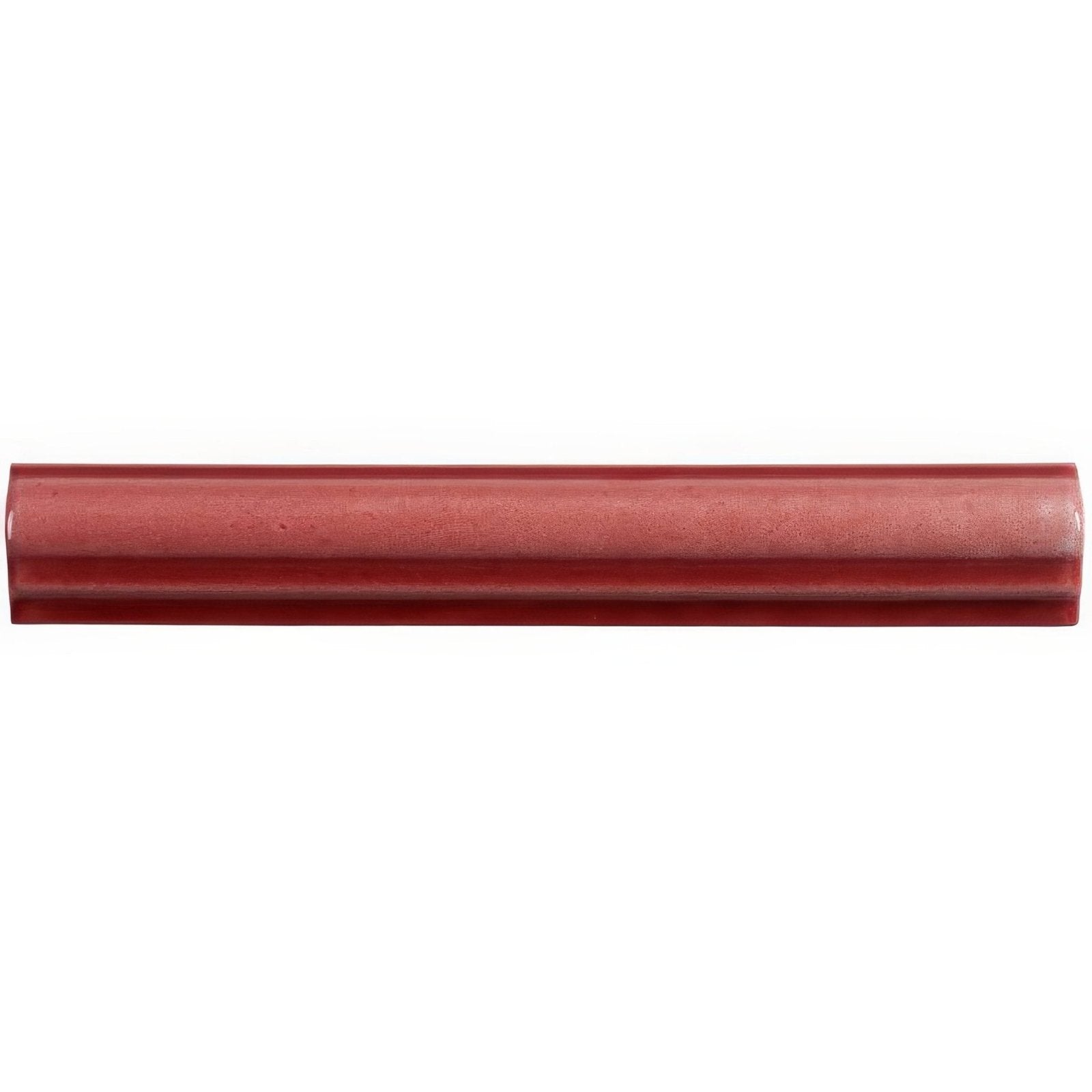 A sleek glossy red ceramic Rioja ogee moulding tile with smooth slightly textured surface and rounded edges