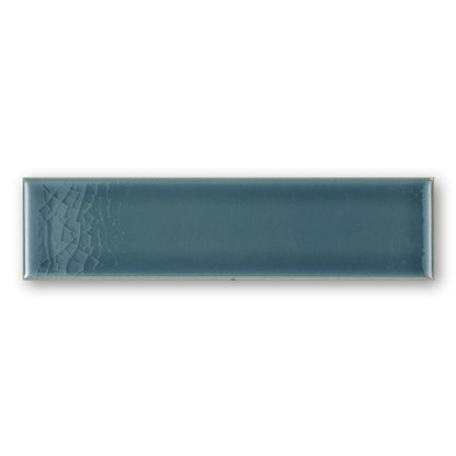 Teal rectangular ceramic tile retro metro green park 5 x 20cm with subtle textured pattern on one end