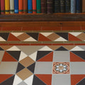 Rochester Black, Holkham Dune, Red, Regency Bath & White with Livingstone Green on Buff in a bathroom setting