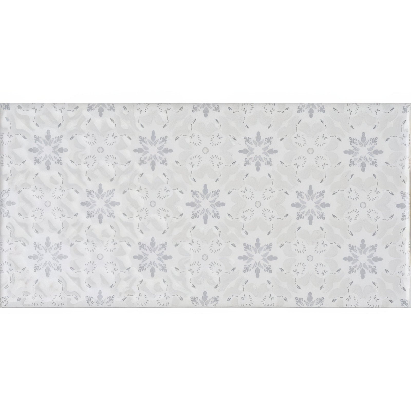 A rectangular white Rosemoor on Helmingham tile with subtle light gray snowflake pattern and delicate decorative elements
