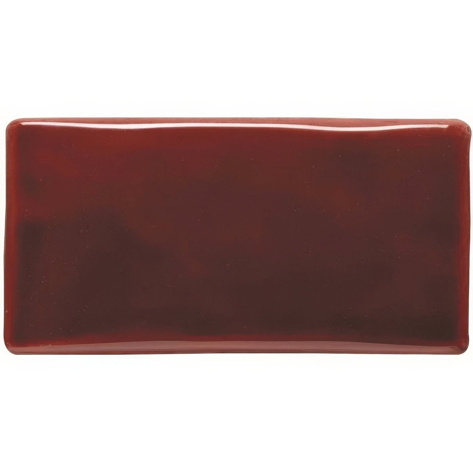 A glossy rectangular ceramic ruby half tile in deep burgundy with rounded edges for wall or backsplash use