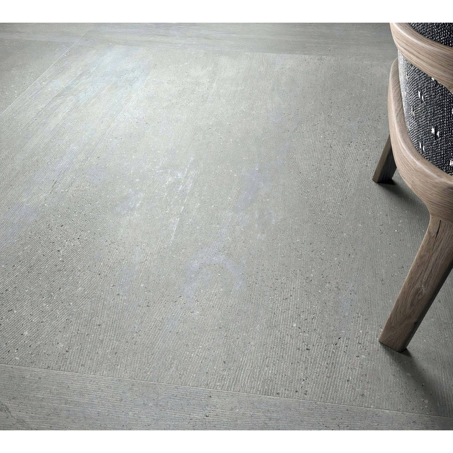 Gray concrete-effect floor tile sakai 1843 silver with subtle texture and speckled finish for modern interiors