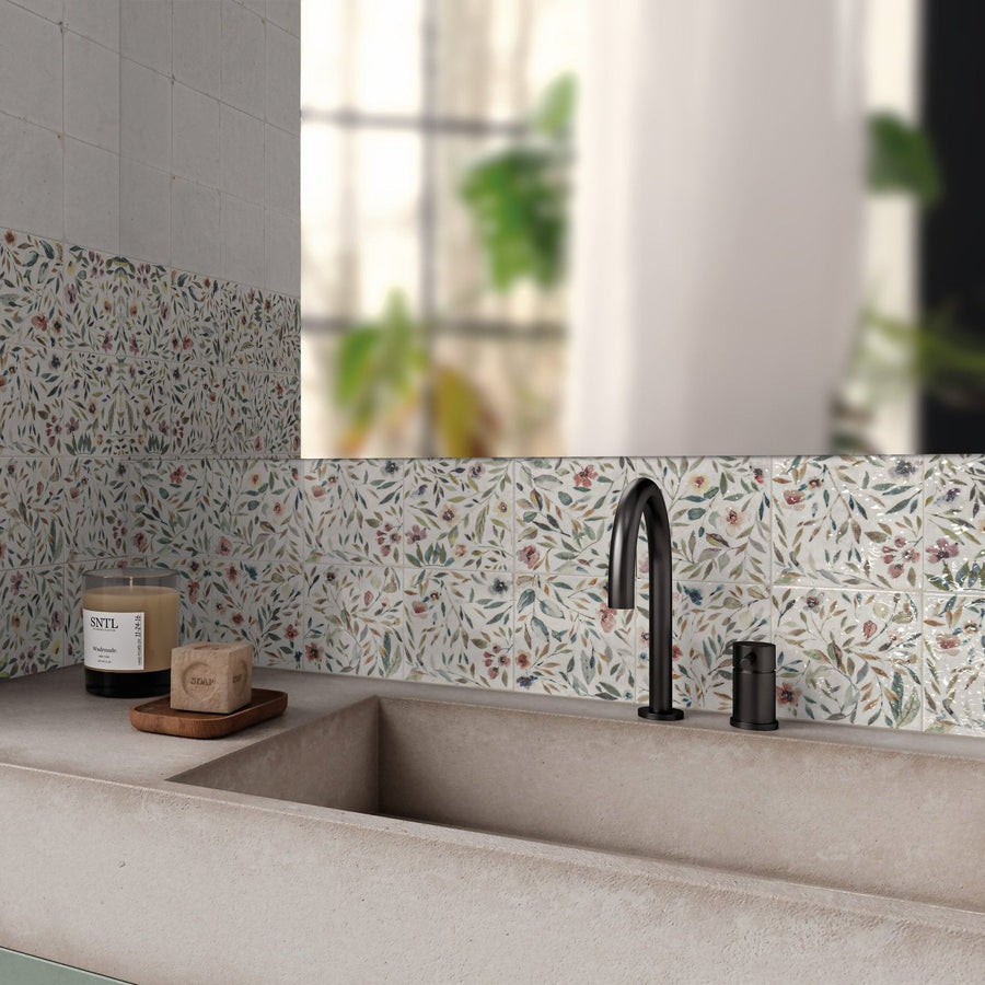 Black matte-finish faucet with curved spout and matching handle from sakura gardens for elegant bathroom use