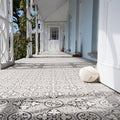 A cream-colored thickly knotted rope ball against a dover white door from the salisbury black collection