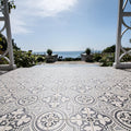 Gray and white patterned ceramic floor tiles with intricate floral and geometric designs in salisbury black on dover white