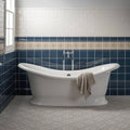 White porcelain clawfoot bathtub with chrome faucet and beige towel in salisbury blue on dover white finish