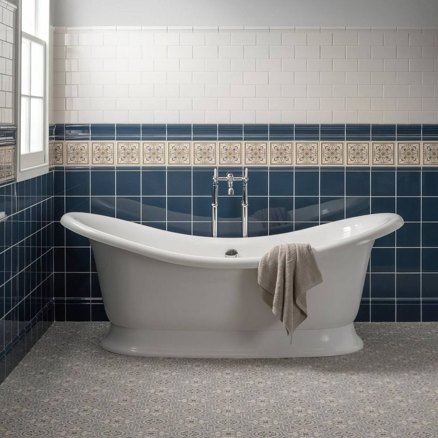 White porcelain clawfoot bathtub with chrome faucet and beige towel in salisbury blue on dover white finish