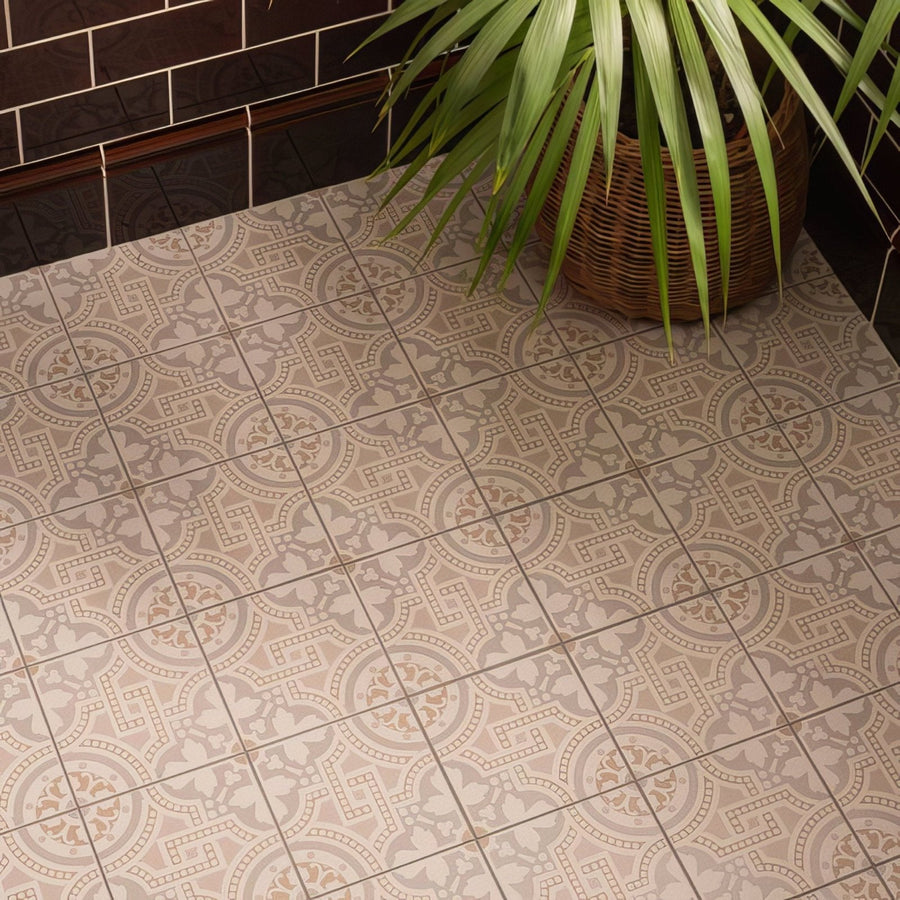 Beige and gray patterned vintage-style floor tiles with intricate geometric and floral designs in Salisbury taupe on dover white