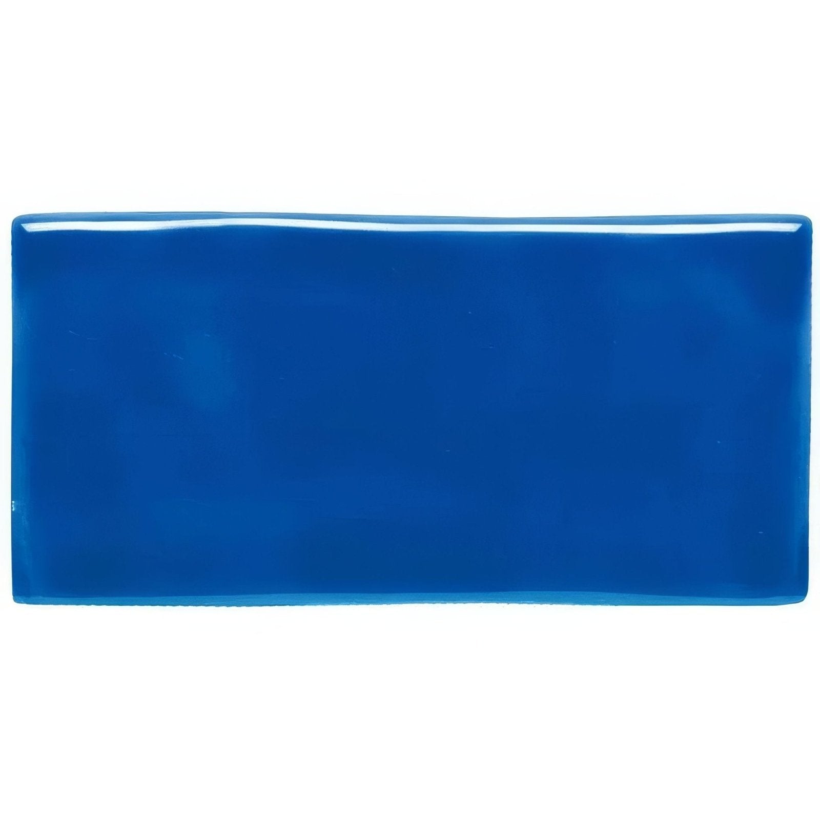 Vibrant cobalt blue rectangular ceramic sapphire half tile with glossy smooth finish ideal for wall use