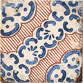 Antique sardinia porcelain masseria ceramic tile with white base blue and rust-red swirling decorative patterns
