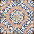 Vintage-style sardinia porcelain masseria ceramic tiles with intricate blue and terracotta floral patterns on cream background