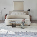 Sardinia Porcelain Masseria blue and terracotta patterned tiles with an upholstered bed
