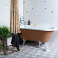 Sardinia Porcelain Tarricone blue and white patterned tiles with a copper bathtub