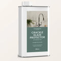 White metal canister with white cap labeled sarsen home crackle glaze protector in green on dark teal background