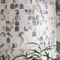 Savoy novo porcelain matt arch mosaic featuring white and gray marble mosaic tiles with scalloped edges in a curved pattern