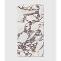 A rectangular slab of savoy porcelain in white with intricate burgundy and dark gray swirling veins