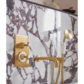 Savoy Porcelain white marble-effect tiles with a gold tap and showerhead