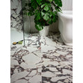Savoy porcelain white marble-effect floor tiles with dark gray and subtle pink veining for elegant interiors