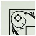Saxon corner black floral and vine decal with central stylized flower on a dover white light-colored surface