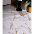 Sculpture Grande porcelain Calacatta Maximus floor tiles in white marble effect with gold and gray veining