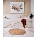 Sculpture Grande Porcelain Calacatta Maximus white marble-effect tiles with a woven bath mat