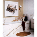 Sculpture Grande Porcelain Calacatta Maximus white marble-effect tiles with a framed sea turtle artwork