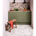 Sculpture Grande Porcelain Cararra white marble-effect tiles with olive green kitchen cabinets