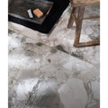 White and gray terrazzo floor tiles with fragmented stone pattern in sculpture grande porcelain ceppo design