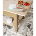 Sculpture Grande Porcelain Ceppo grey terrazzo-effect tiles with a light wood table