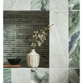 Seaspray Green Stacked Mosaic green and white marble stacked mosaic with a white vase of flowers