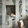 Seaspray Green Stacked Mosaic green and white marble stacked mosaic with a dark metallic pitcher