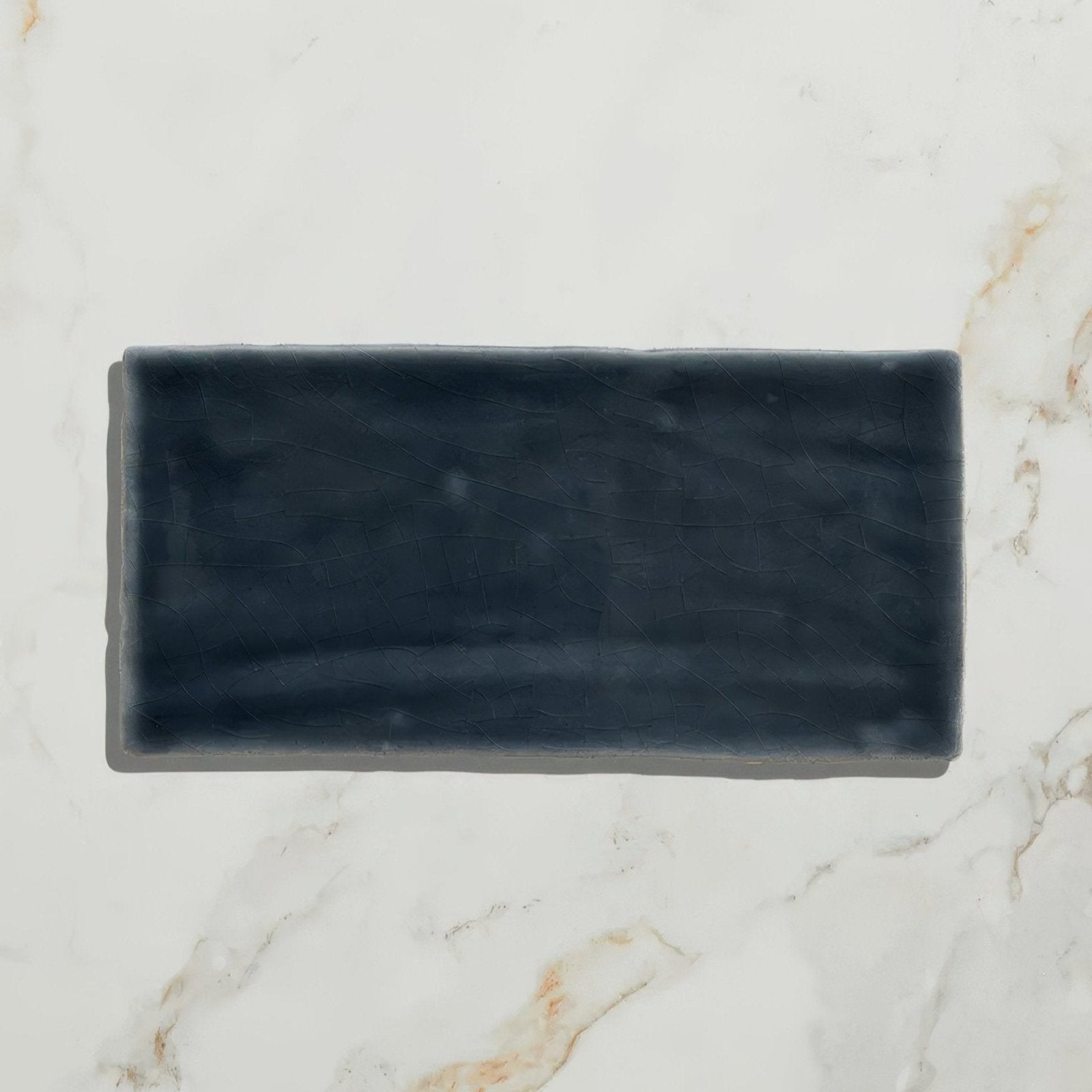 Dark gray rectangular ceramic tile with matte slightly textured surface from seaton ceramic beach hut collection